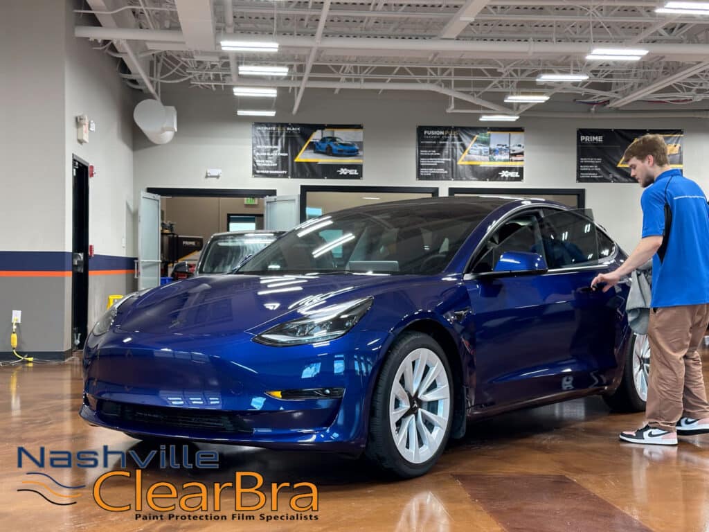 Tesla Model 3 Blue Xpel Paint Protection Film. Tesla Model 3 owners, especially those in Brentwood and Franklin, Tennessee, understand the importance of protecting their investment. With the increasing number of Teslas on the road, maintaining the pristine condition of your vehicle is more crucial than ever. At Nashville ClearBra, we specialize in applying XPEL Paint Protection Film (PPF) to ensure your Tesla Model 3 in Blue remains flawless. This blog post delves into the benefits of XPEL PPF, the services we offer, and why choosing Nashville ClearBra is the best decision for your Tesla Model 3.