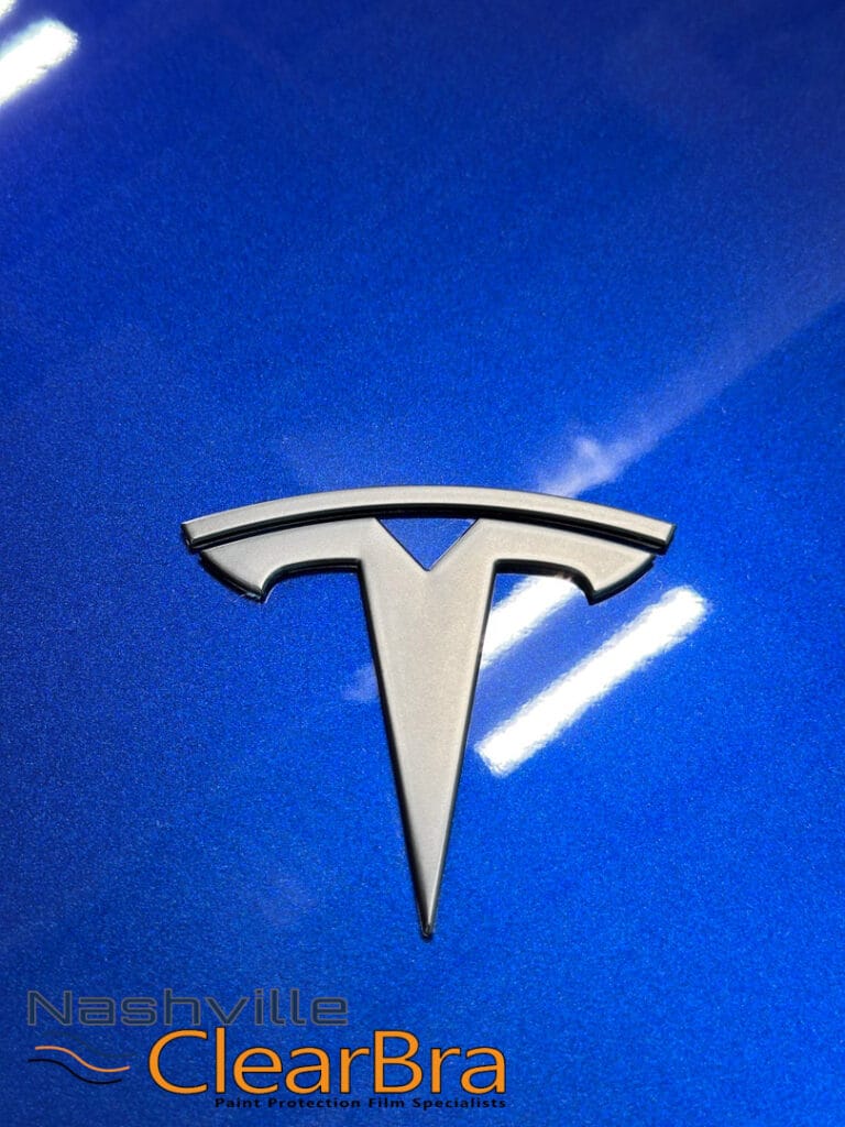 Tesla Model 3 Blue Xpel Paint Protection Film. Tesla Model 3 owners, especially those in Brentwood and Franklin, Tennessee, understand the importance of protecting their investment. With the increasing number of Teslas on the road, maintaining the pristine condition of your vehicle is more crucial than ever. At Nashville ClearBra, we specialize in applying XPEL Paint Protection Film (PPF) to ensure your Tesla Model 3 in Blue remains flawless. This blog post delves into the benefits of XPEL PPF, the services we offer, and why choosing Nashville ClearBra is the best decision for your Tesla Model 3.